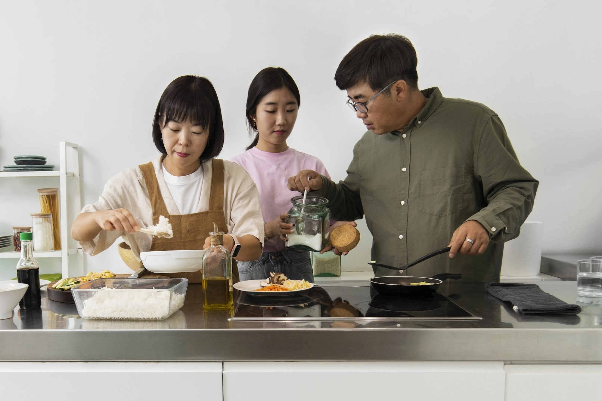 Family cooking with myanmar maid indonesian maid in the kitchen by maid agency in singapore